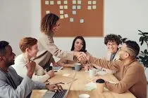 A newcomer meeting the team — illustration for an article about employee onboarding